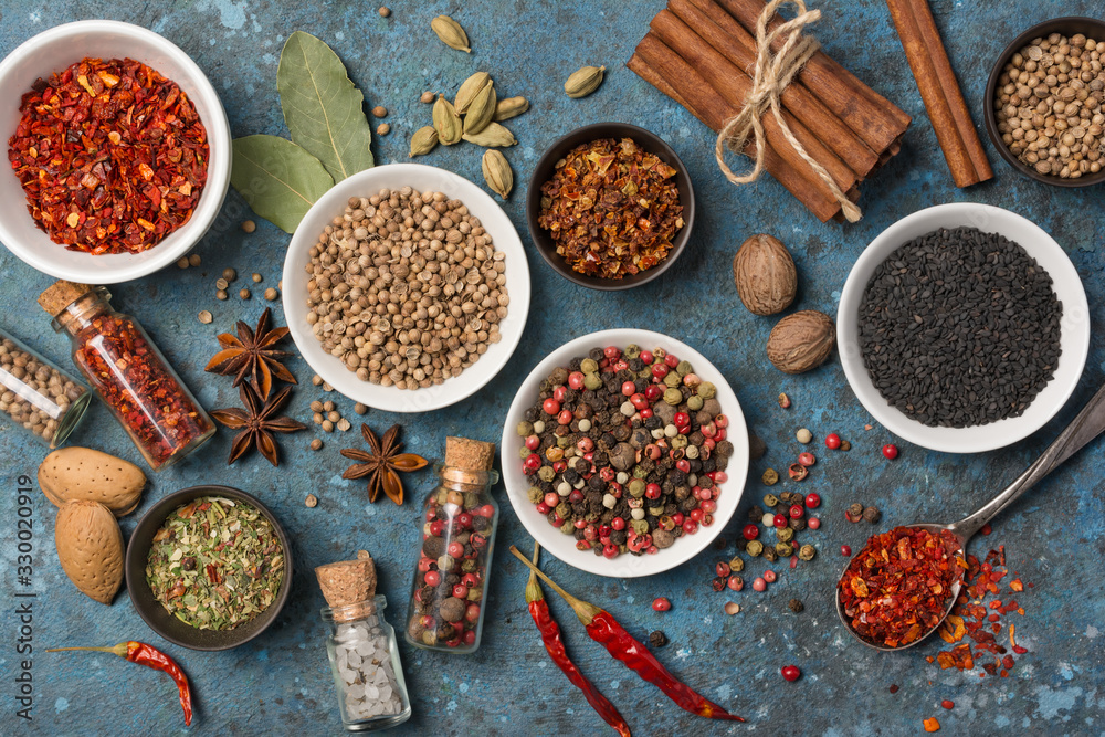 Different spices, kitchen herbs and seeds for tasty meals