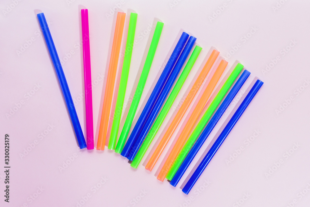 Color cocktail paper straw on a background. flat lay Color cocktail paper straw on a background. flat lay