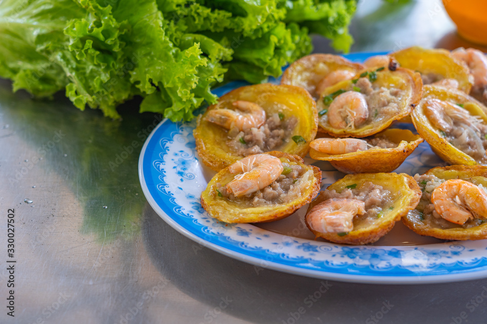 Banh Khot- Vietnamese tiny shrimp pancake served with vegetables Banh Khot- Vietnamese tiny shrimp pancake served with vegetables