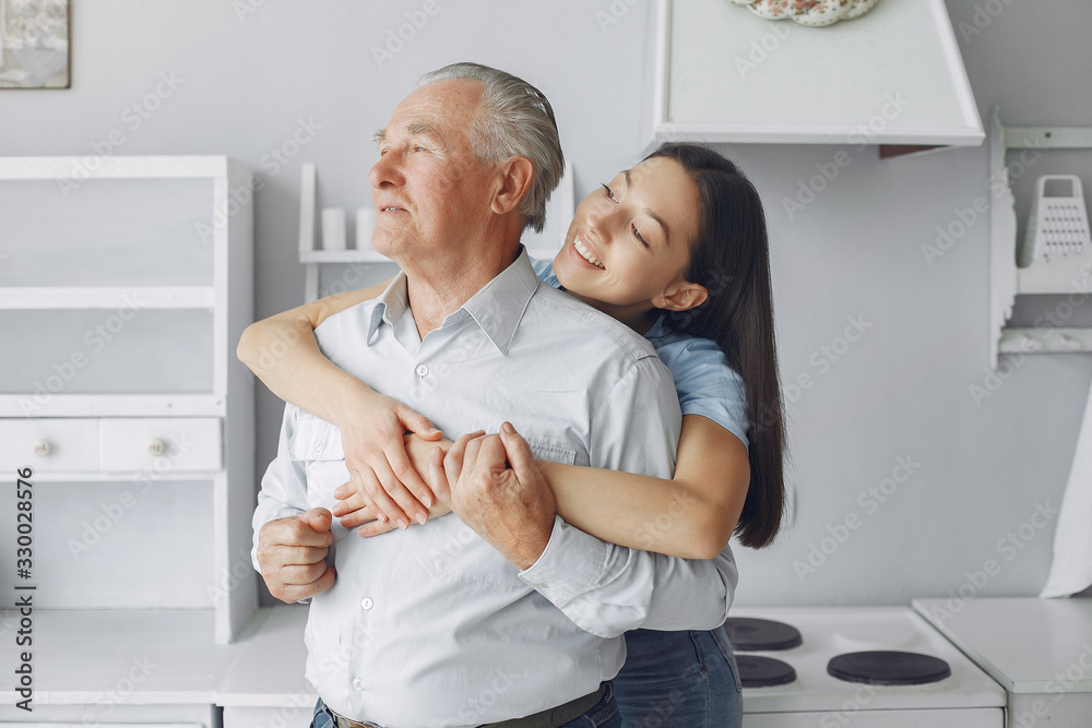 Man in a room. Grandfather sitting at home. Family with a vegetables Man in a room. Grandfather sitting at home. Family with a vegetables