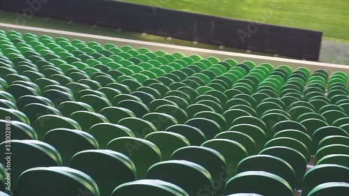Empty plastic seats in a stadium. Matches to be played without fans.