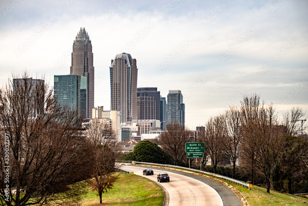 Fototapeta premium sunset and overcast over charlotte nc cityscape
