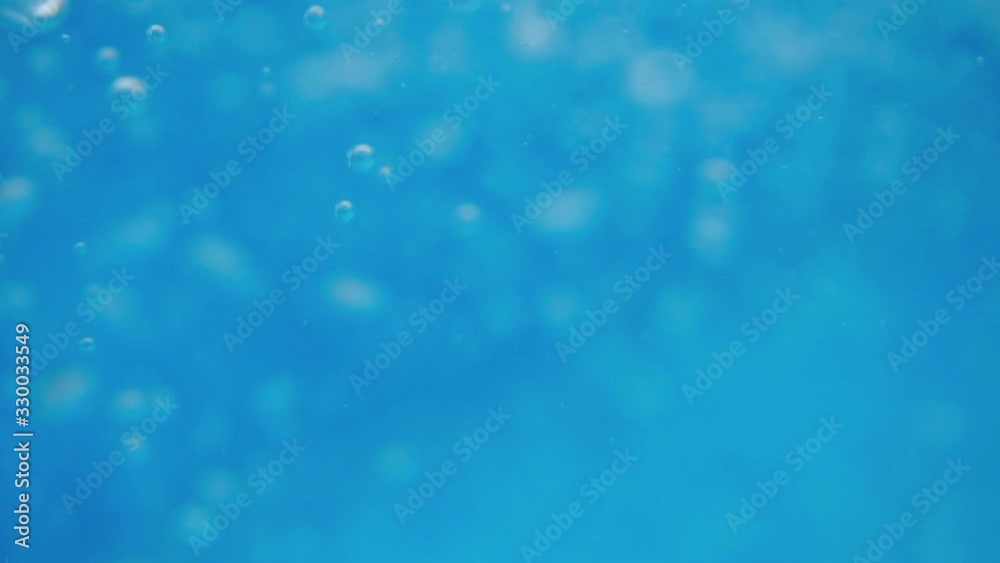 Bubbles rising to the surface. Air bubbles in water in swimming pool (underwater shot), good for backgrounds. Slow motion. Bubbles rising to the surface. Air bubbles in water in swimming pool (underwater shot), good for backgrounds. Slow motion.