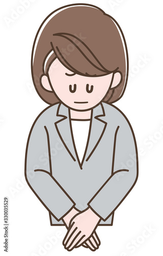 おわびをするスーツの女性