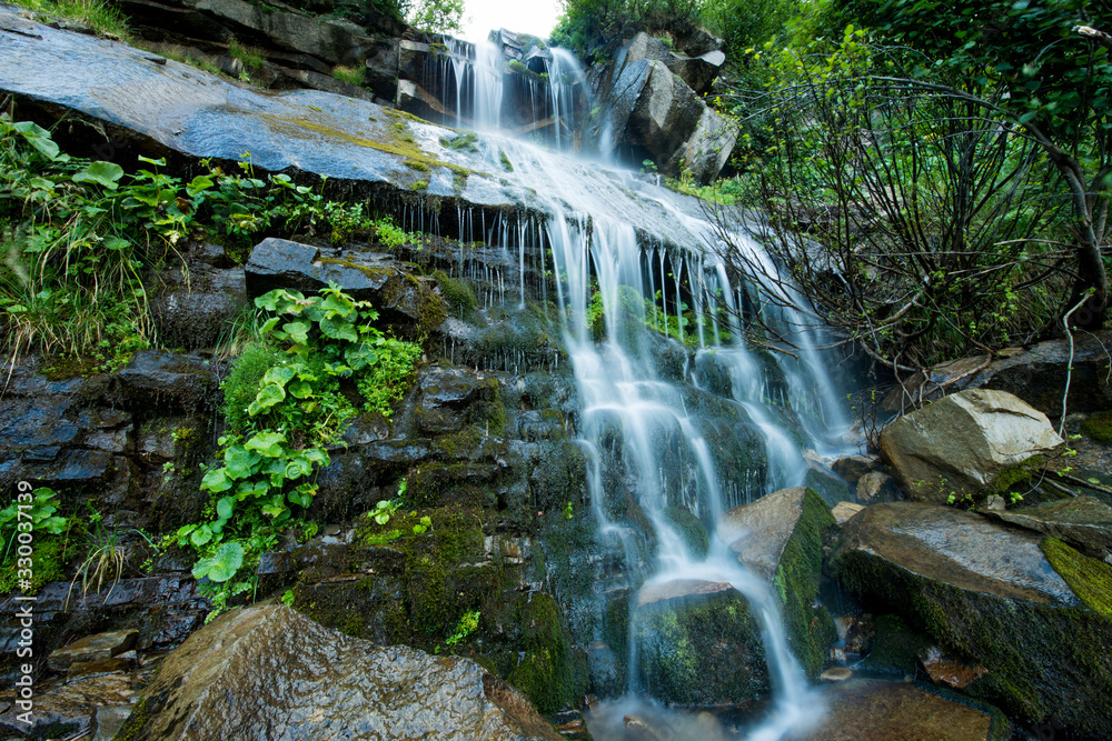 Scenic waterfall in the green Carpathian mountains Scenic waterfall in the green Carpathian mountains