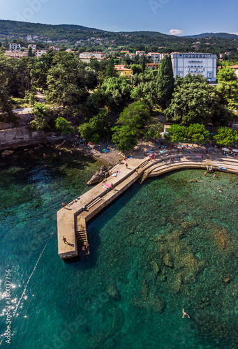 Beautiful panoramic view of Lovran village and its sea shore in Croatia. Top view photo taken on drone.