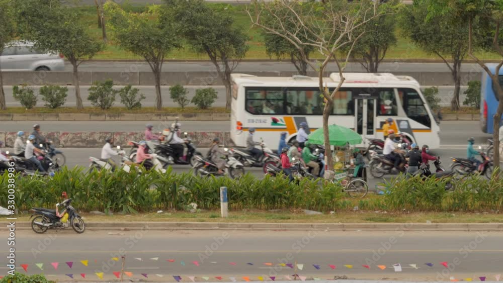Slow motion shot of layered busy traffic on Vietnamese highway Slow motion shot of layered busy traffic on Vietnamese highway