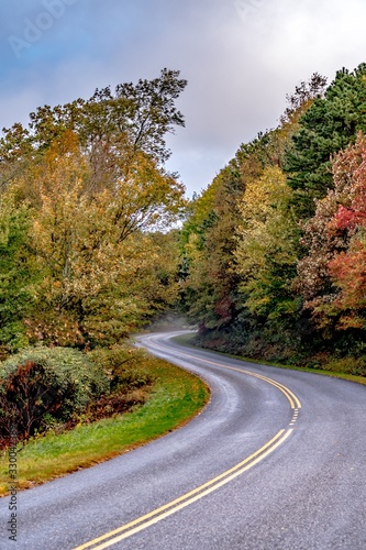 early morning foggy autumn roads on blue ridge parkway near asheville nc