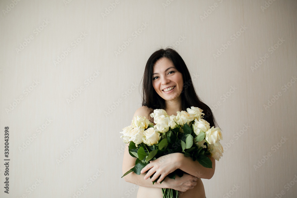 pretty happy girl holding a bouquet of roses pretty happy girl holding a bouquet of roses