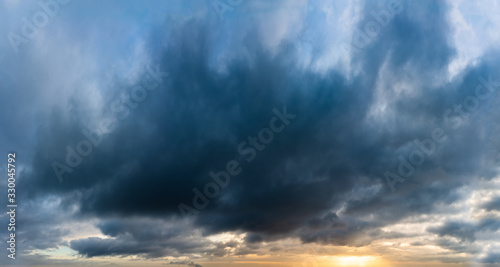 Fantastic dark thunderclouds at sunrise