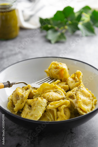 Cooked tortellini on a plate, close up pasta, italian food.