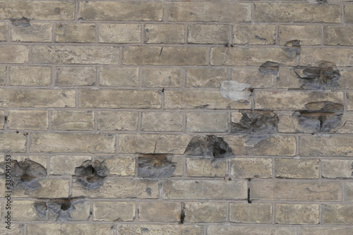 Bullet holles on the brick wall photo