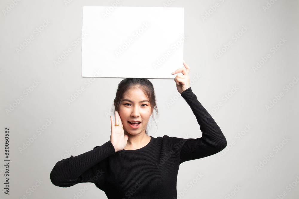 Young Asian woman surprise with white blank sign. Young Asian woman surprise with white blank sign.