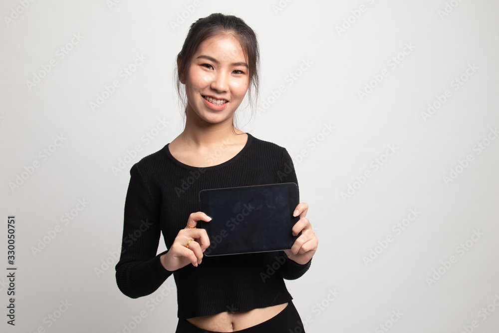 Young Asian woman with a computer tablet. Young Asian woman with a computer tablet.