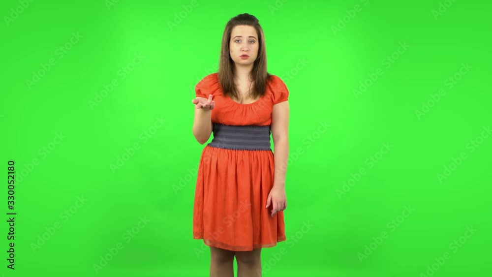 Tired girl waving hand and showing gesture come here. Green screen Tired girl waving hand and showing gesture come here. Green screen