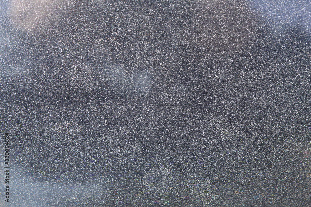 Fototapeta premium Dusty dirty glass of a car in zoom.