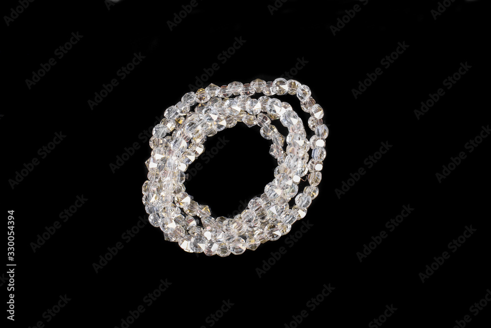 Natural stone beads on a black background isolated