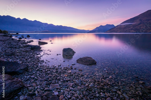 Fototapeta Naklejka Na Ścianę i Meble -  Amazing and colorful morning by a lake on South Island of New Zealand. Pure natural scene, beautiful nature, peaceful, quiet. Heaven on earth, travel destination, vacation spot. Must see place.