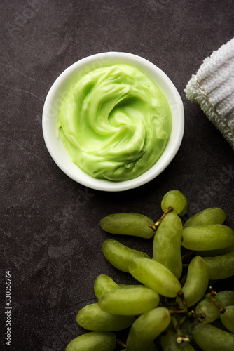 Green grapes, yogurt and honey mix face mask or cream for skin dark spot removal treatment, created using Angoor extract, curd and honey. selective focus photo