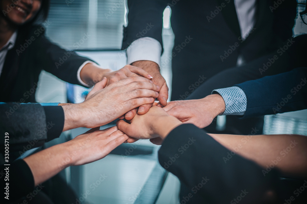 close up. business team making a tower out of hands close up. business team making a tower out of hands