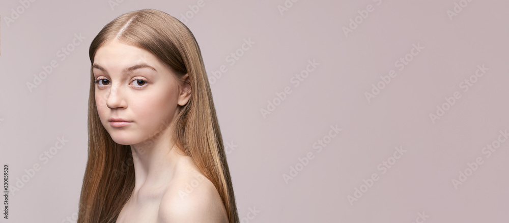 Naklejka premium Young pretty woman studio portrait. Cosmetology concept. Esthetic woman face. Skin care dermatology beauty contour. Harmony girl. For cream, lotion horizontal banner. Copyspace