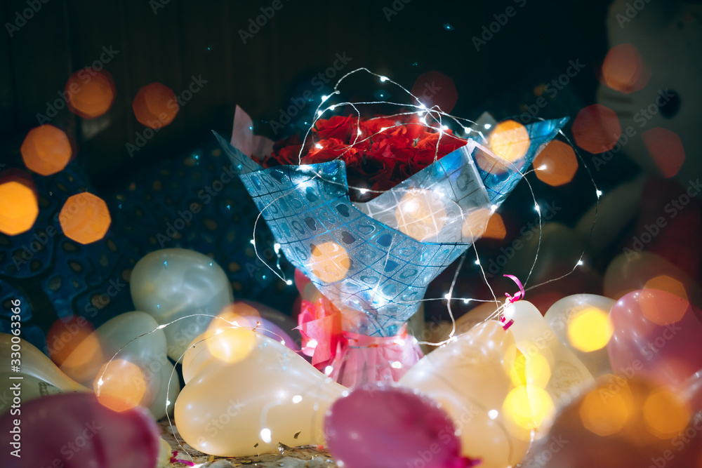 Bouquet of roses with bokeh lights