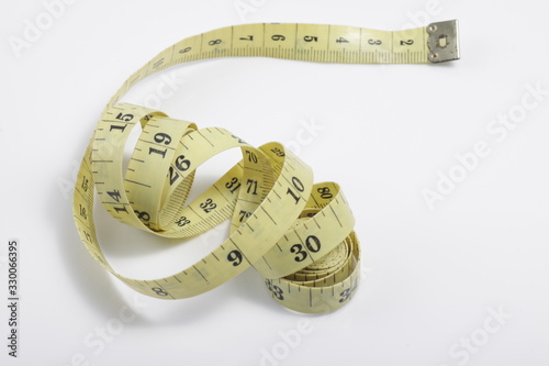 Close up shot of measurement tape isolated on white background