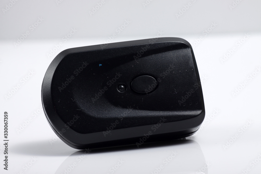 Close up shot of black camera flash trigger isolated on white background Close up shot of black camera flash trigger isolated on white background