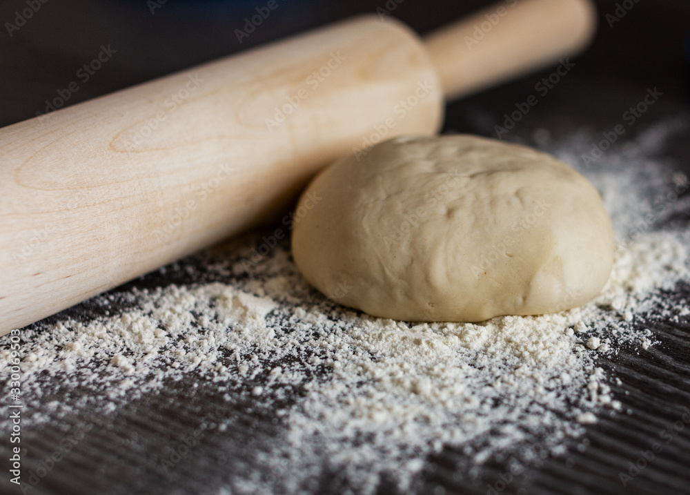 The dough and rolling pin The dough and rolling pin