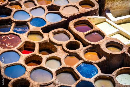 Fez is also famous for its old leather Tanneries. Old tanks of the Fez's tanneries with color paint for leather, Morocco, Africa. Artistic picture. Beauty world photo