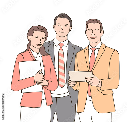 Group of business partners looking at camera with smiles