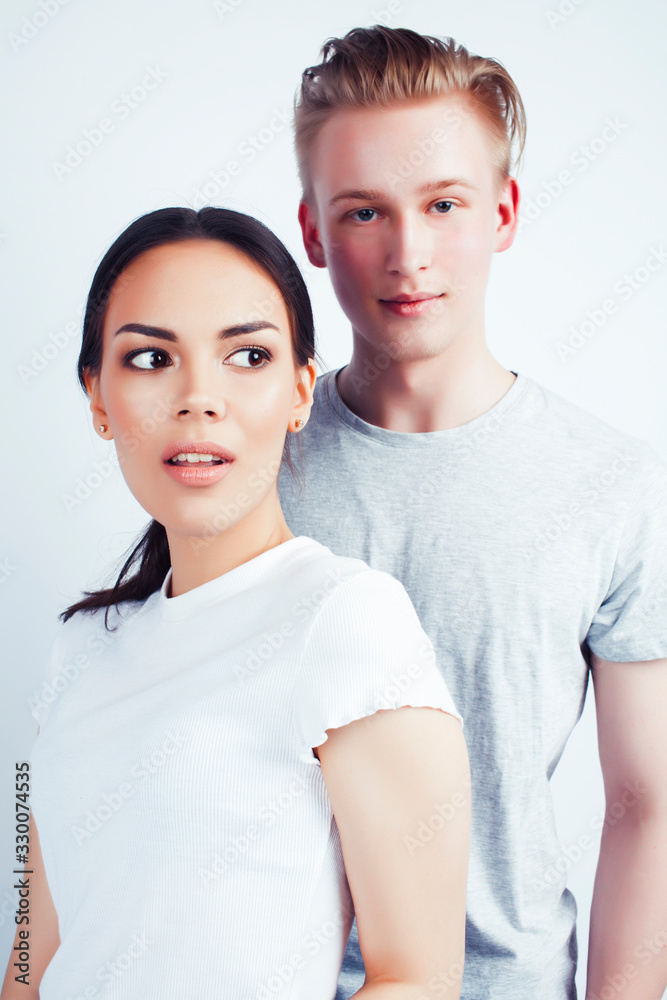 modern hipster guys together couple diverse nations, asian girl and caucasian blond boy isolated on white background, lifestyle people concept modern hipster guys together couple diverse nations, asian girl and caucasian blond boy isolated on white background, lifestyle people concept