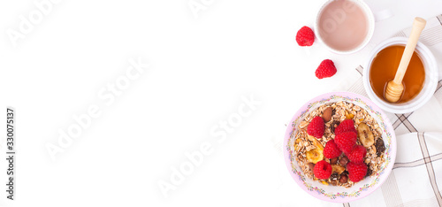 Morning Granola, Fruits,honey, fresh coffee. Berries in bowl on grey concrete background. Healthy breakfast cereals. Concept of dieting, healthy clean eating . Copy space. flat lay. Banner. 