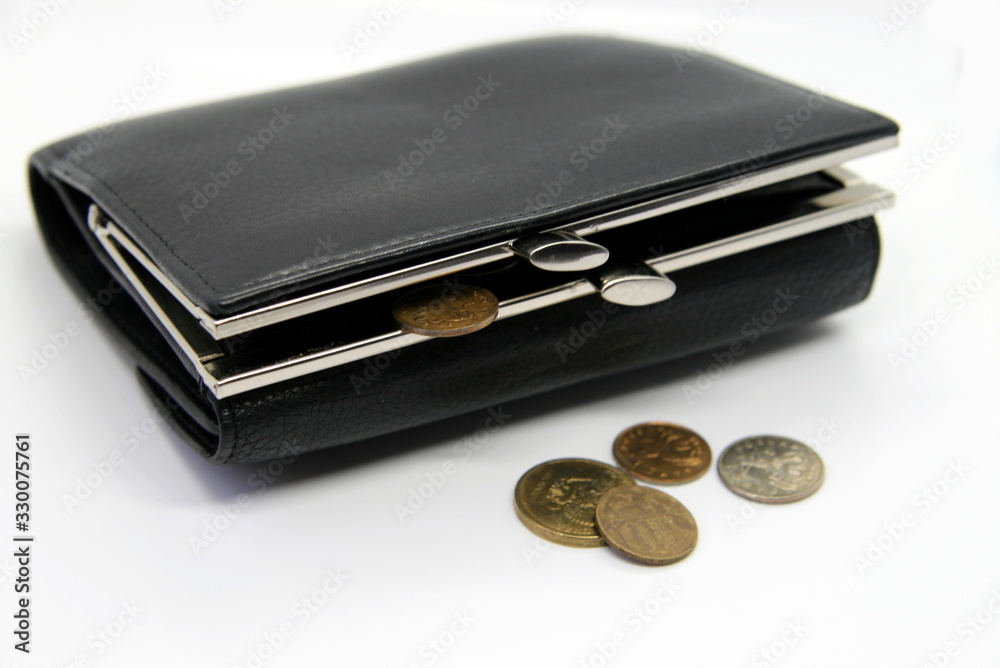 Black wallet with coins on a white background, crisis and poverty Black wallet with coins on a white background, crisis and poverty
