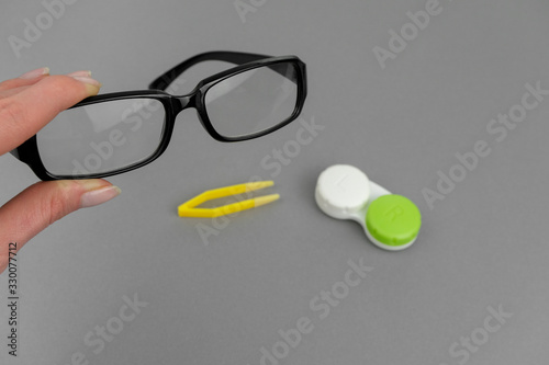Optician flat lay background. Concept of optics. .Flat lay eye care products on grey background. .