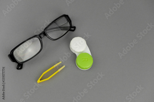 Optician flat lay background. Concept of optics. .Flat lay eye care products on grey background. .