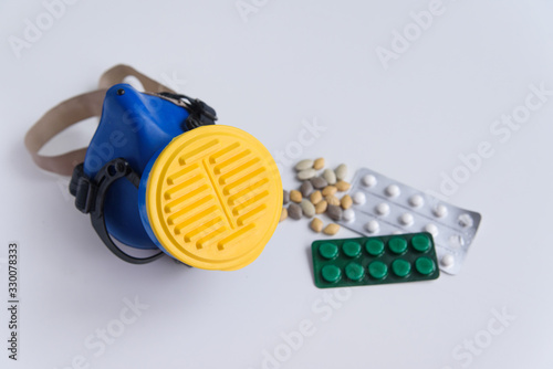 Respirator Mask and Medical Equipment and Medication with Text Space on white background. Cornonavirus. Pandemic. Flu Epidemic.  Pandemic preparation. copy space photo