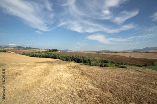 Magnificent Tuscan rolling hills landscape in the Val d"Orcia Valley. World heritage site in Tuscany Italy on July 2019