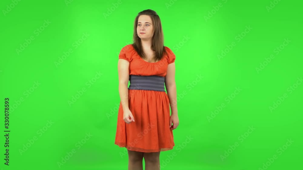 Angry girl is scolding, shaking her index finger and threatening with a fist. Green screen Angry girl is scolding, shaking her index finger and threatening with a fist. Green screen