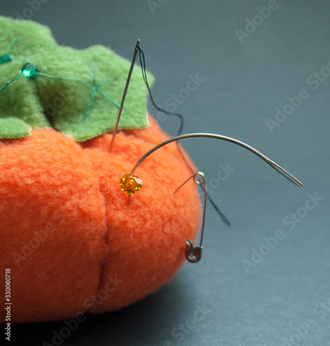pumpkin stick with stuck pins photo