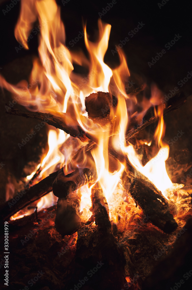Fire wood brighly burning in furnace. Firewood burn in rural oven. Burning firewood in fireplace closeup. Fire and flames. Close up of burning fire wood in fireplace Fire wood brighly burning in furnace. Firewood burn in rural oven. Burning firewood in fireplace closeup. Fire and flames. Close up of burning fire wood in fireplace