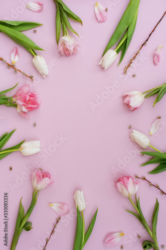 Creative layout made of colorful spring flowers and green leaves. Minimal holiday concept. Flat lay pattern. © Olga