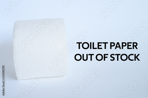 rolled white toilet paper on a white background and text toilet paper out of stock. ofl font photo