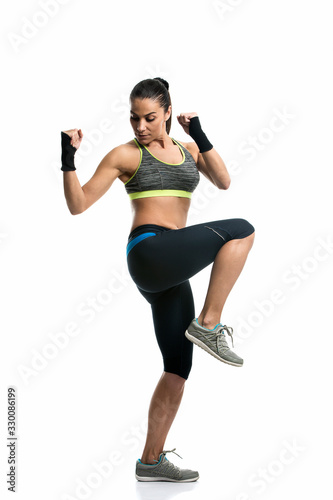 young woman doing fitness exercise isolated on white