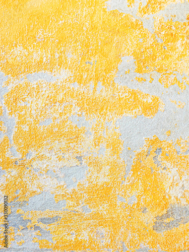 Abstract yellow cement wall texture and background.