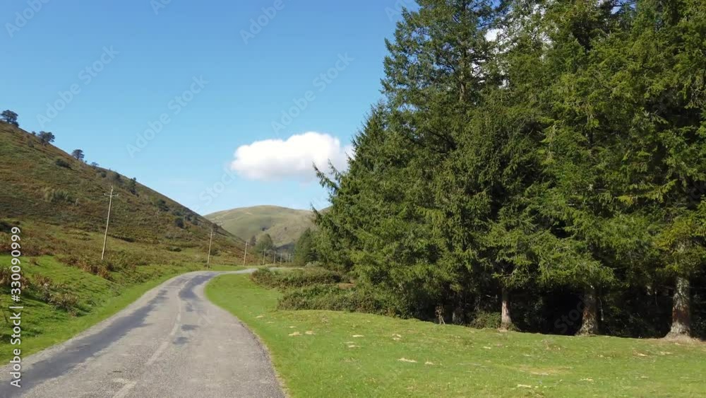 Pyrenees country road time lapse POV driving video footage 4k amidst green mountains, hills and valleys, France, Pyrenees country road time lapse POV driving video footage 4k amidst green mountains, hills and valleys, France,