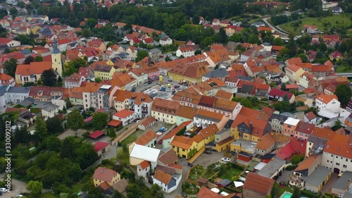 Aerial view of the city Radeburg in east Germany on a cloudy day in summer. Wide view of downtown with pan to the left. photo