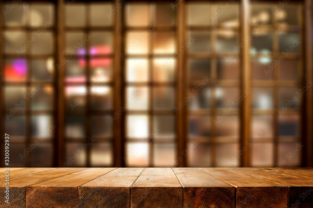 Desk of free space and wooden window background Desk of free space and wooden window background