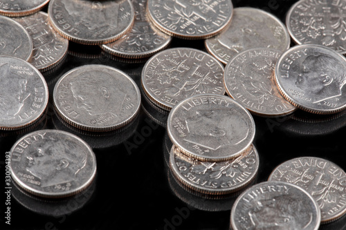 Close up of United States coins, Dimes on black ground