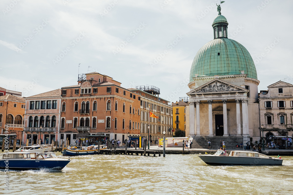 VENICE, ITALY - JUNE 17, 2019: San Simeone Piccolo church in Venice on the Grand Canal in front of the train station Santa Lucia. Summer.Sunny day.